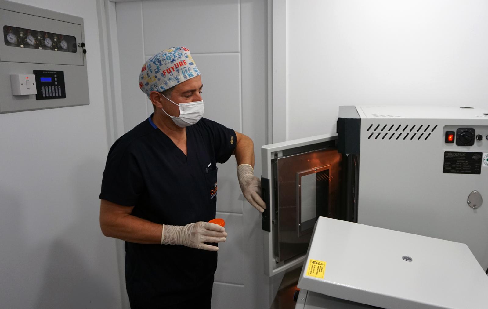Embryologist at the incubator in the Fertina IVF laboratory