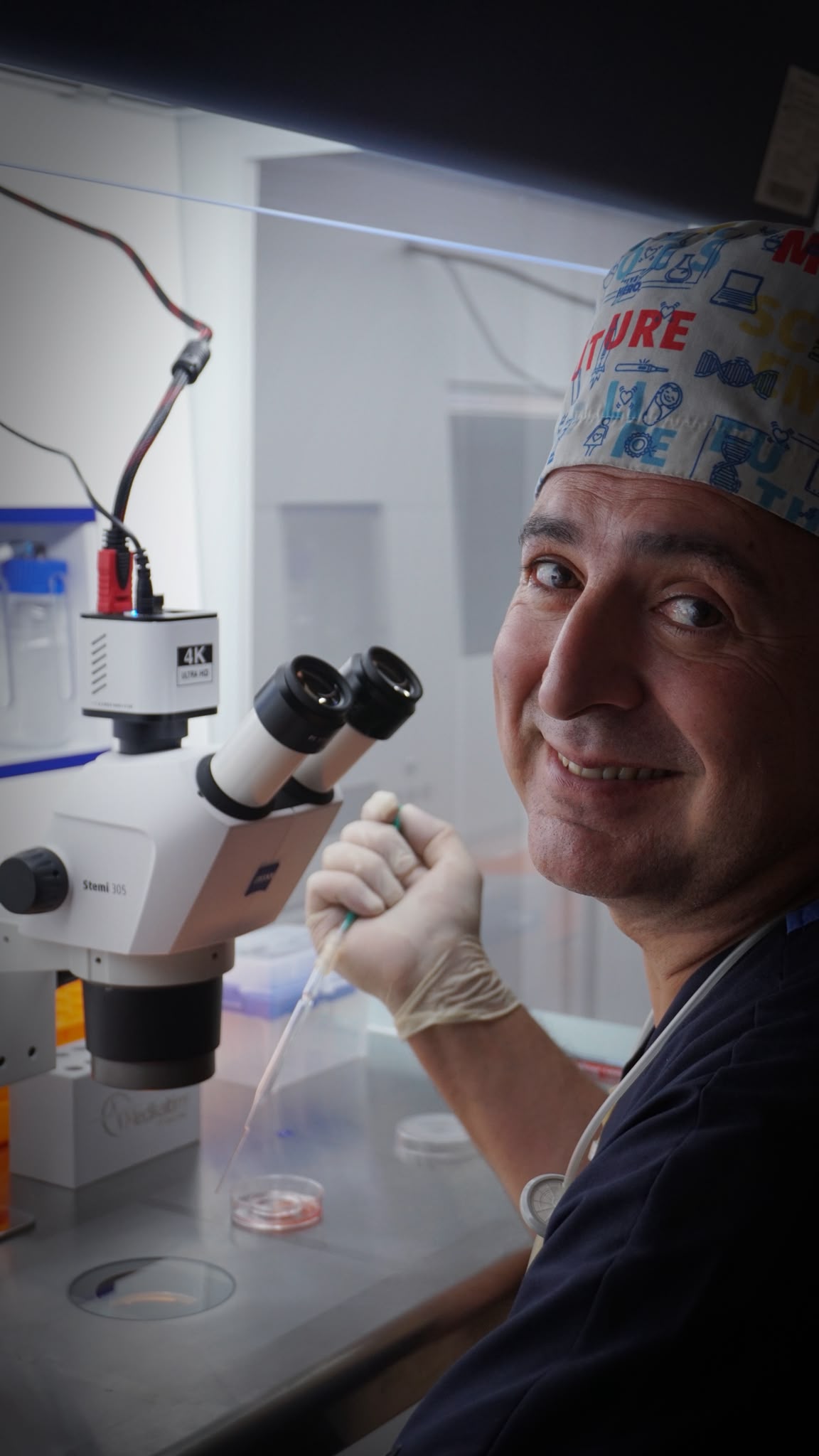 Embryologist Ali Kizilkanat at the microscope in the Fertina IVF laboratory